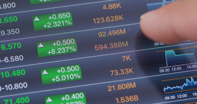 Digital tablet computer showing stock market data graph